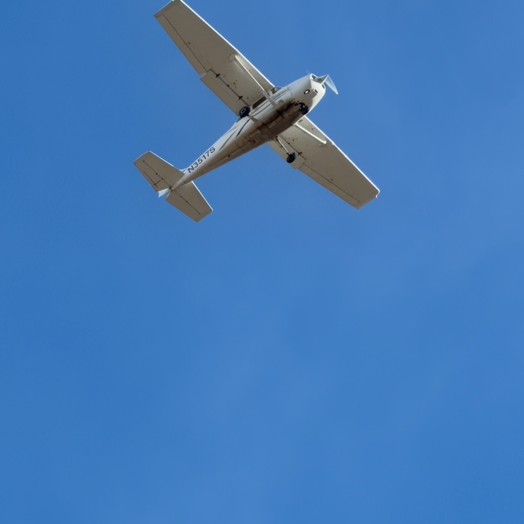 Cessna 172RG Cutlass N3517S on final for runway 30R at Rocky Mountain Metropolitan Airport, registration visible under the wing